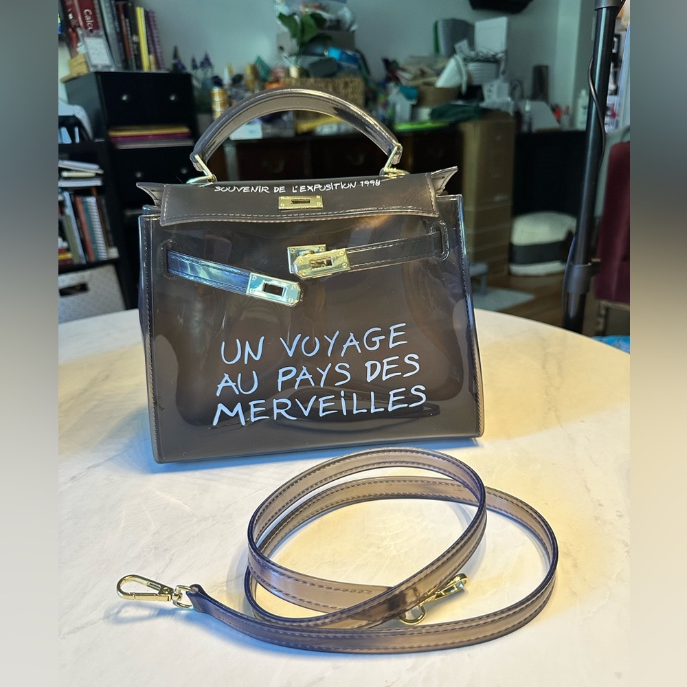 Unbranded grey see through 'kelly' bag. Great for concerts and stadiums.